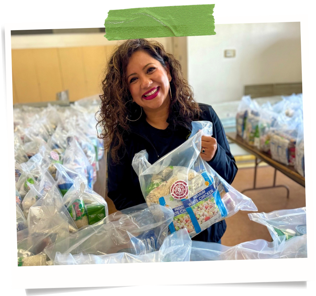 Resource Center team member with food support supplies
